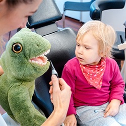 Small child getting dental demonstration 